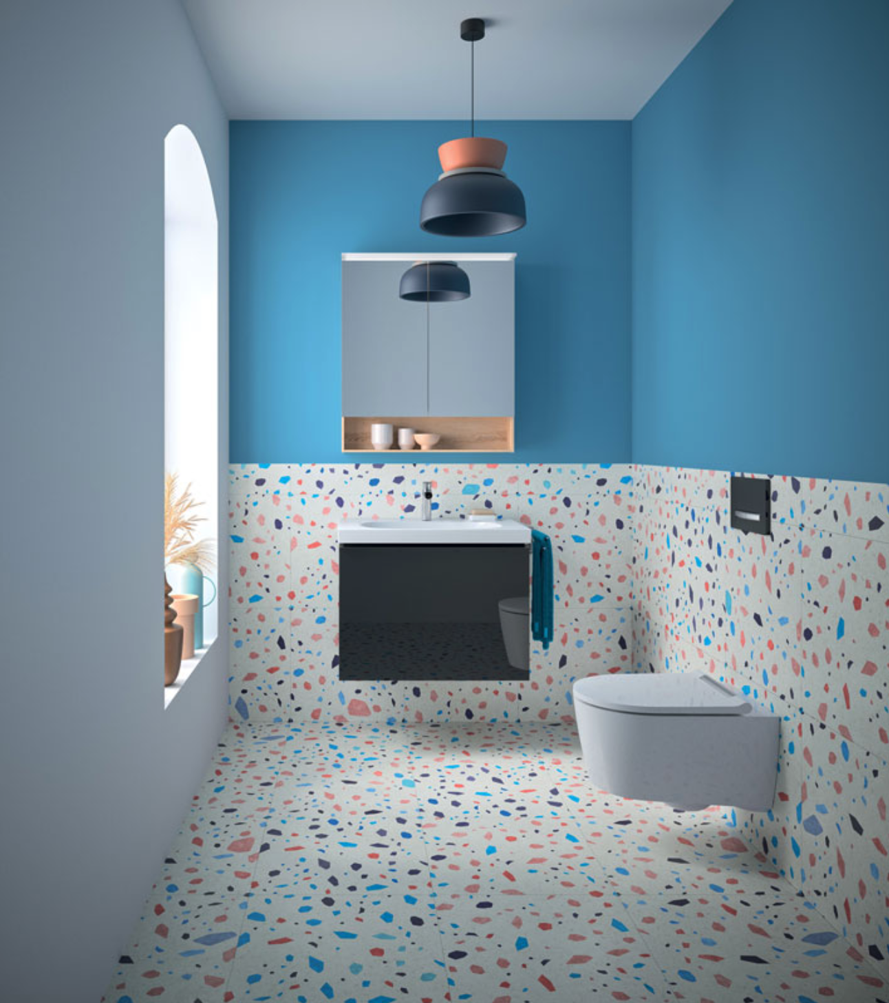 Un espace toilette raffiné avec un wc Geberit, sol en terrazzo multicolore et murs bleus